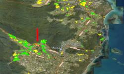 The red arrow arrow points to the infested farm in the Tully river valley. The green areas indicate farms that have been surveyed for TR4, whereas the yellow ones indicate farms that had not yet been surveyed at the time. (Courtesy of Queensland DAF)